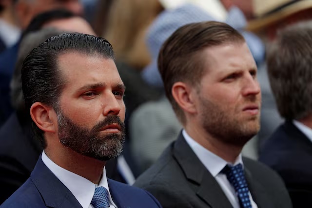 Donald Trump Jr. and Eric Trump attend the commemoration ceremony for the 75th anniversary of D-Day at the American cemetery of Colleville-sur-Mer in Normandy, France, June 6, 2019. REUTERS/Carlos Barria/File Photo 