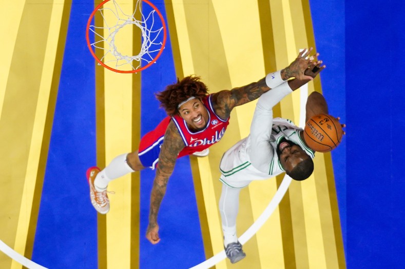 Jaylen Brown goes for a shot against Kelly Oubre Jr of the 76ers. AP