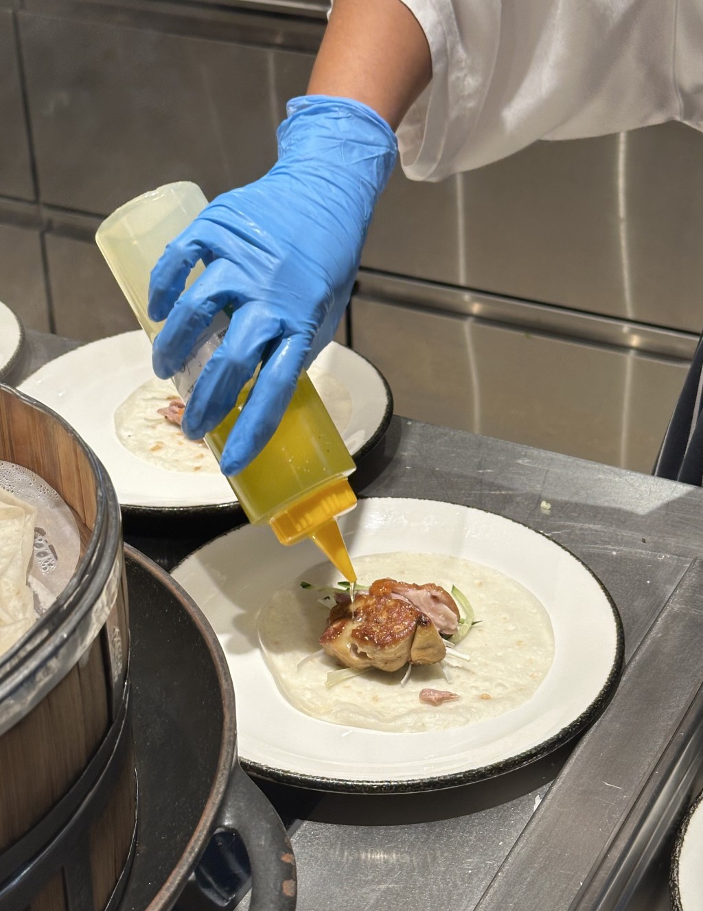 Duck Foie Gras & Peking Duck with shaved summer black truffle is prepared at the live stations.