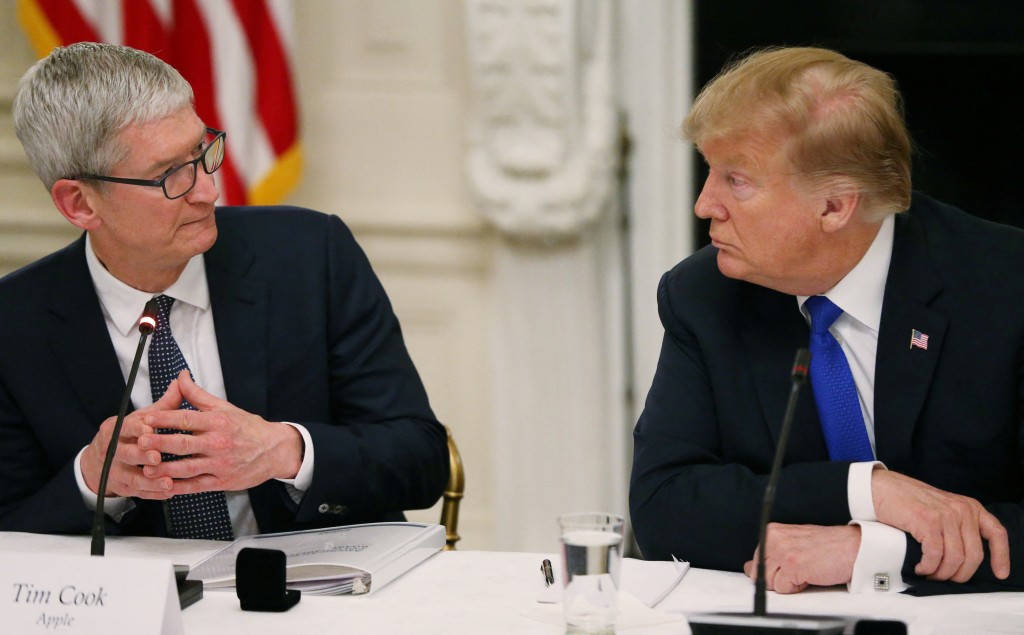 Apple CEO Tim Cook speaks as he and U.S. President Donald Trump participate in an American Workforce Policy Advisory Board meeting in the White House State Dining Room in Washington, U.S., March 6, 2019. REUTERS/Leah Millis/File Photo