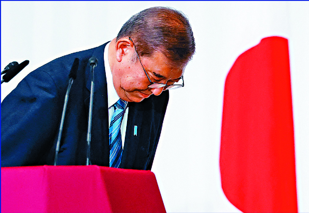 Shigeru Ishiba bows after his party fails to win a majority in the lower house. AFP Shigeru Ishiba bows after his party fails to win a majority in the lower house. AFP