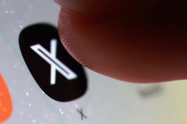 The X app icon on a smartphone in this illustration taken October 27, 2025. REUTERS/Dado Ruvic/Illustration