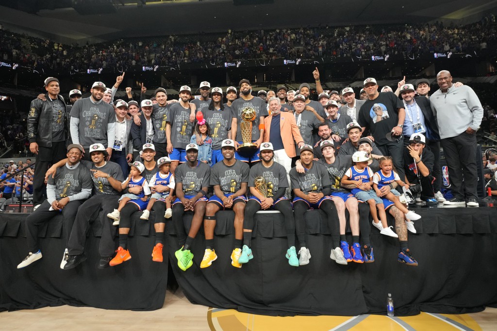 The New York Knicks pose for a team photo after winning the Larry O'Brien Championship Trophy during Game Five of the 2026 NBA Finals on June 13, 2026 at Frost Bank Center in San Antonio, Texas (AFP)