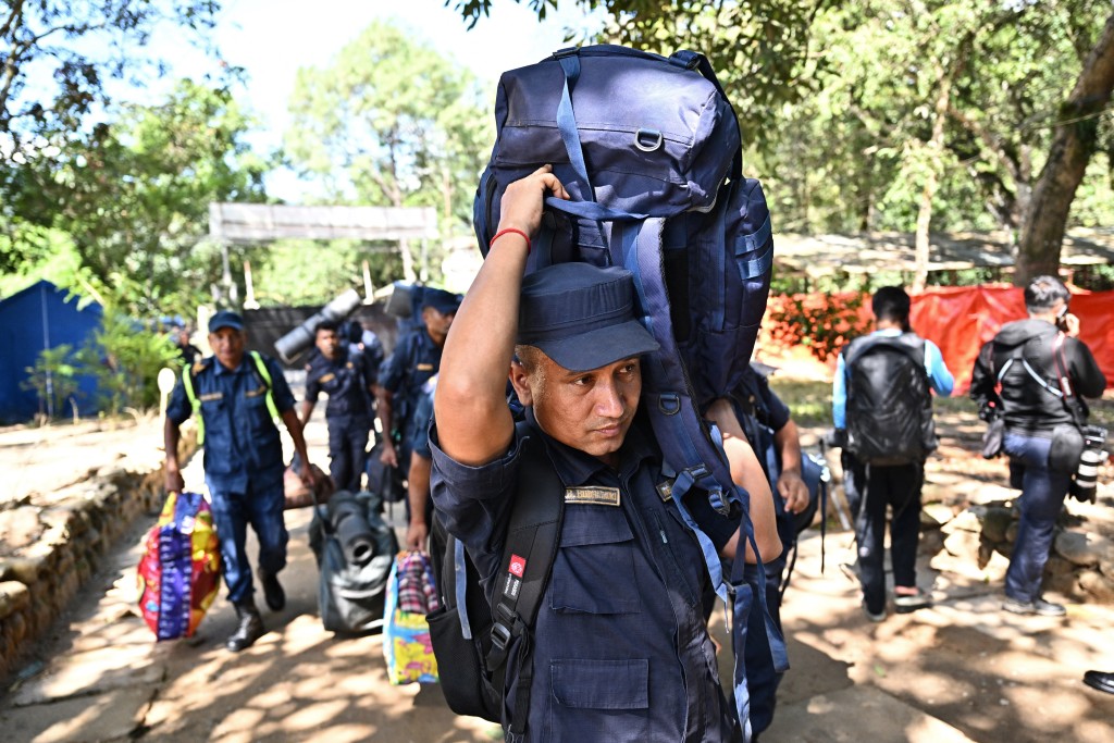 Photo by PEDRO PARDO / AFP  Army personnel are seen at a temporary relief camp in the aftermath of flash floods at Trishuli Bazar in Nepal's Nuwakot district on September 5, 2026.