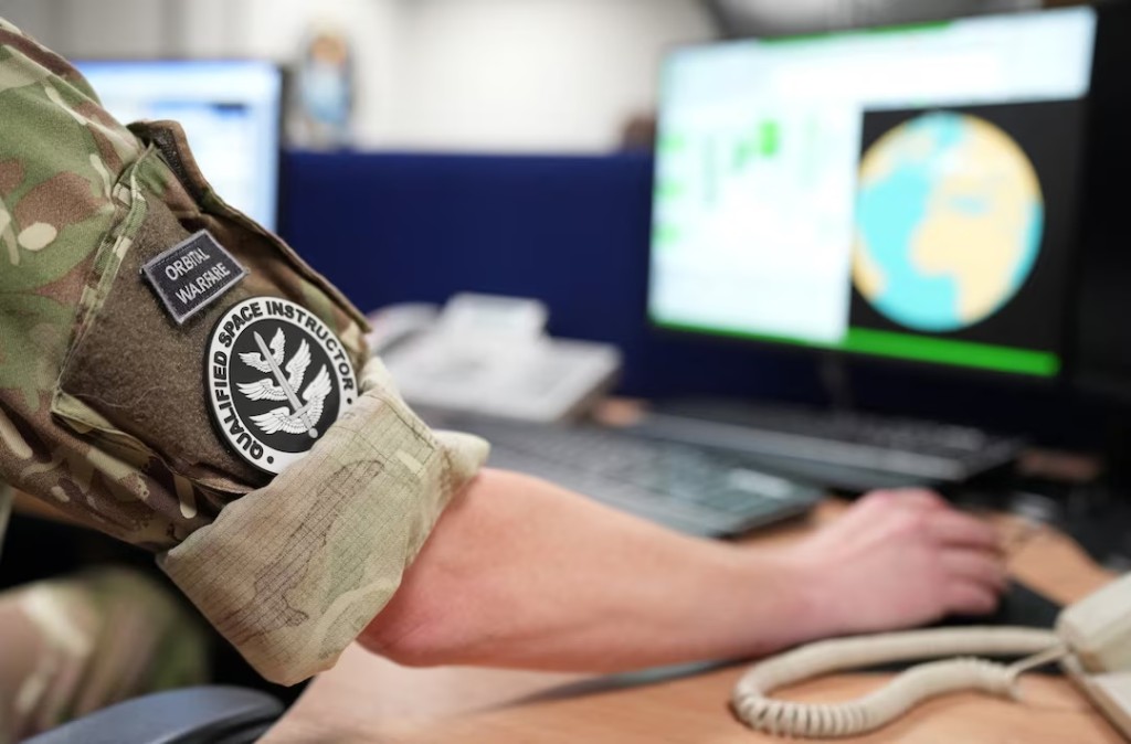 Space operators take part in a simulation of a missile warning event in the simulation room at RAF Fylingdales, which provides continuous ballistic missile early warning and space surveillance services to the UK and U.S. governments, helping ensure that a surprise missile attack cannot succeed, in North Yorkshire, Britain, October 1, 2025. REUTERS/Dominic Lipinski