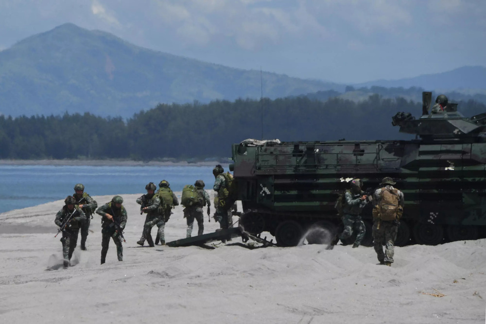 Philippine and US marines disembark from amphibious assault vehicles during a joint landing exercise at a beach. (AFP) Philippine and US marines disembark from amphibious assault vehicles during a joint landing exercise at a beach. (AFP)