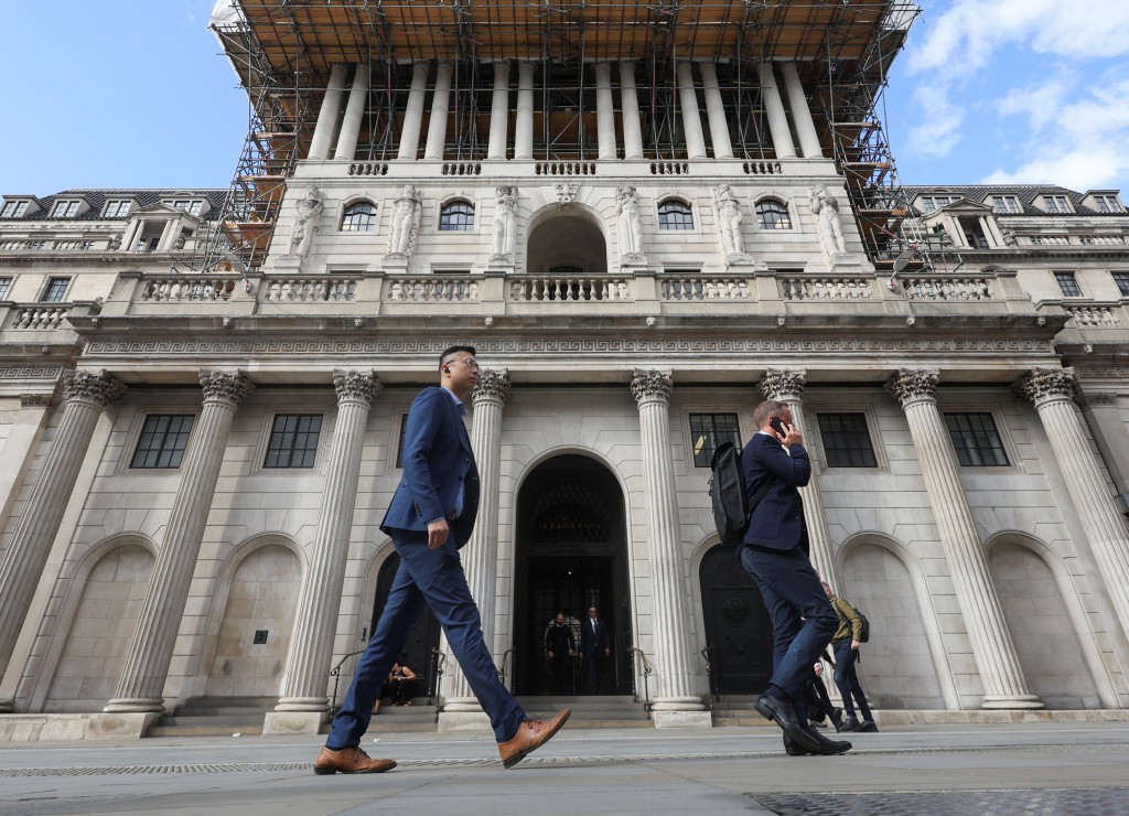 People walk past the Bank of England building in London, Britain, September 16, 2026. REUTERS/Corey Rudy