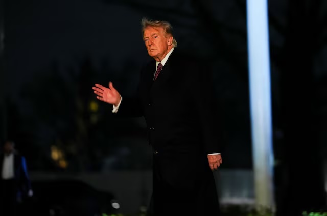 U.S. President Donald Trump gestures as he arrives back to the White House in Washington, D.C., U.S., March 15, 2026. REUTERS/Aaron Schwartz