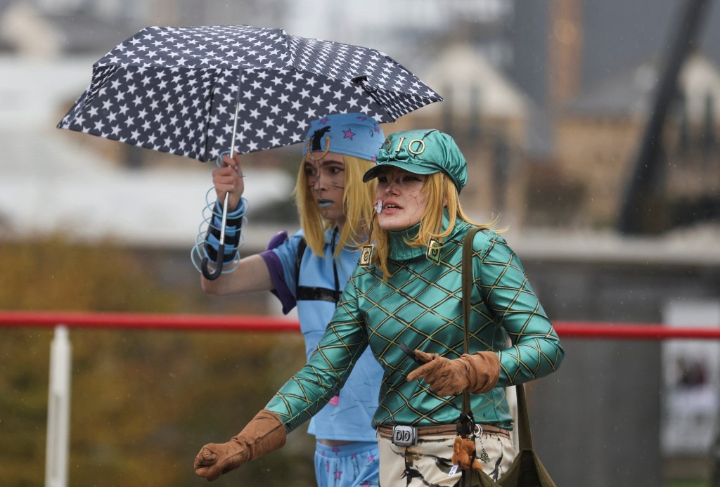 People shelter from the rain as Storm Boelo brings wet and windy weather to parts of the UK