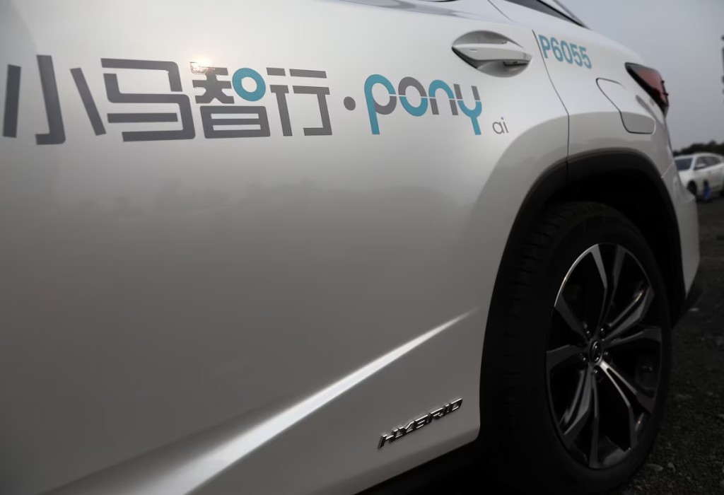 A logo of Pony.ai is seen on a Lexus vehicle equipped with the company's autonomous driving system, which will serve as a robotaxi, in Beijing, China May 13, 2021. REUTERS