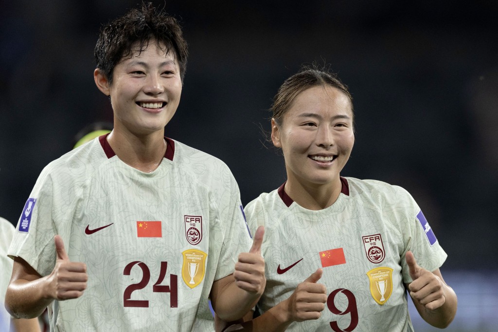China's Yuan Cong (L) and teammate Wurigumula (R) celebrate after winning the AFC Women's Asian Cup Australia 2026 football match between China and North Korea in Sydney on March 9, 2026. (Photo by Steve CHRISTO / AFP) 