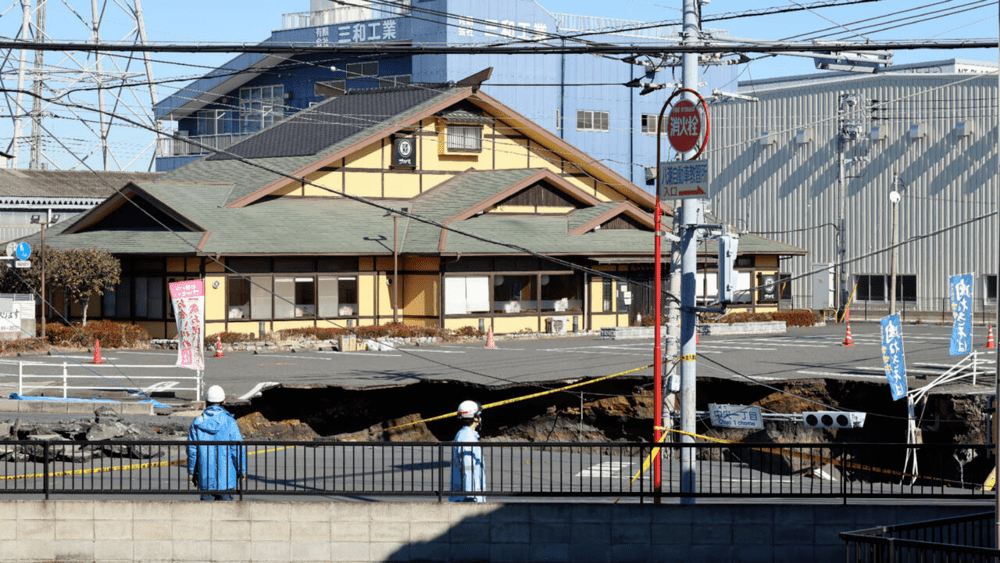 Rescue efforts in Yashio have been severely hampered by unstable ground around the hole and a second, larger hole appearing © STR / JIJI Press/AFP Rescue efforts in Yashio have been severely hampered by unstable ground around the hole and a second, larger hole appearing © STR / JIJI Press/AFP