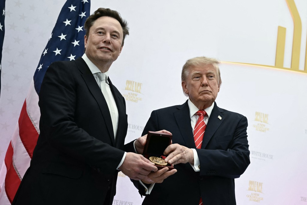 US President Donald Trump presents the National Medal of Science to Elon Musk during the "Golden Age of American Innovation Summit" at the Institute of Peace in Washington, DC, on October 8, 2026.