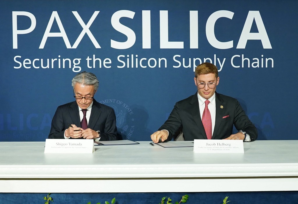 (L-R) Ambassador of Japan to the United States, Shigeo Yamada and Under Secretary of State for Economic Affairs, U.S. Department of State, Jacob Helberg sign the Pax Silica Declaration, an agreement focused on economic security and the establishment of a new grouping of partners tailored for the AI economy at Donald J. Trump Institute of Peace on December 11, 2025 in Washington, DC. Leigh Vogel/Getty Images for Undersecretary of State for Economic Affairs Jacob Helberg/AFP