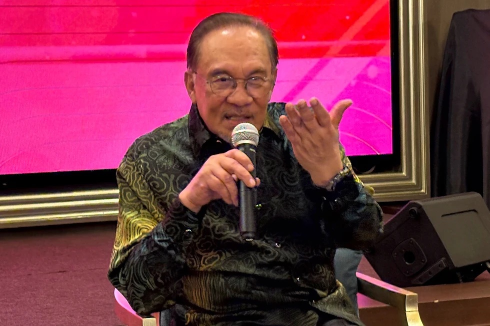 Malaysian Prime Minister Anwar Ibrahim speaks at a media briefing in the government capital of Putrajaya, Malaysia, ahead of a series of summits of the Association of Southeast Asian Nations next week, Wednesday, May 21, 2025.(AP Photo/Eileen Ng)
