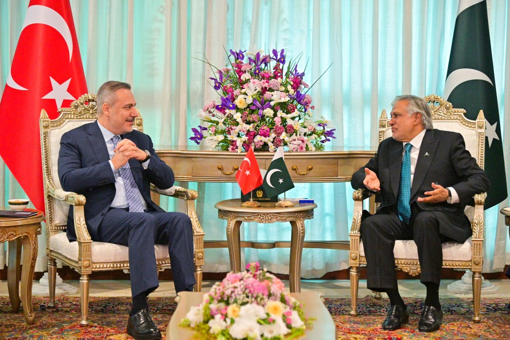 Pakistan's Foreign Minister Ishaq Dar (R) speaking with his Turkish counterpart Hakan Fidan during their meeting at Foreign Ministry office in Islamabad. (AFP)