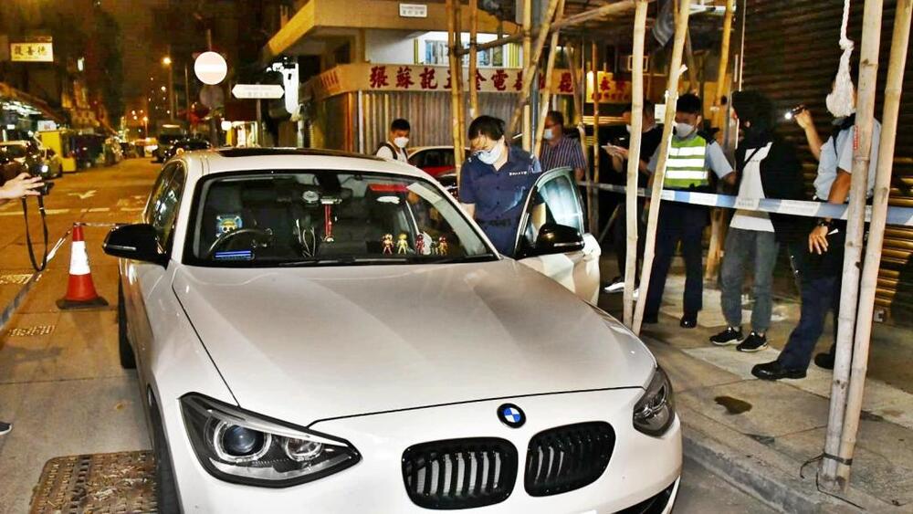 Police intercept the white BMW in Yau Ma Tei on Friday morning. 