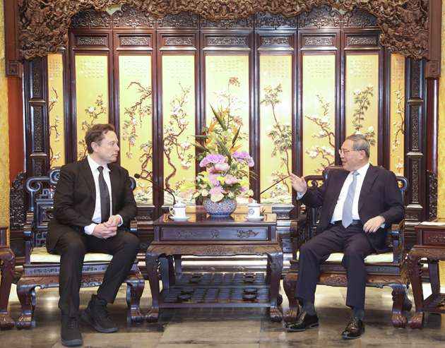Elon Musk and Li Qiang. Elon Musk and Li Qiang.