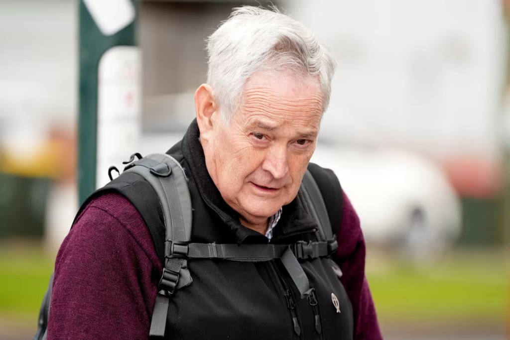 Ian Wilkinson, the sole surviving guest from a fatal lunch served by Erin Patterson who is accused of murdering three of her estranged husband's elderly relatives with a meal laced with poisonous mushrooms, arrives at the Latrobe Valley Law Courts in Morwell, Australia, June 25, 2025. (REUTERS/Asanka Brendon Ratnayake/File Photo)