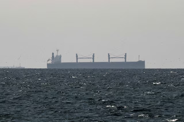 A cargo ship in the Gulf, near the Strait of Hormuz, as seen from northern Ras al-Khaimah, near the border with Oman’s Musandam governance, amid the U.S.-Israeli conflict with Iran, in United Arab Emirates, March 11, 2026. REUTERS/Stringer/File Photo