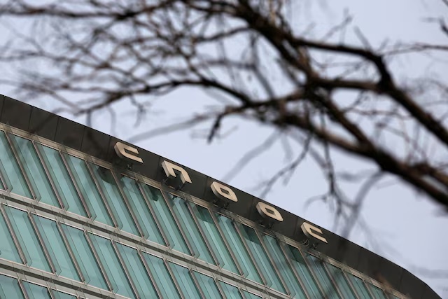 A building of China National Offshore Oil Corp (CNOOC) headquarters is pictured in Beijing, China March 8, 2021. REUTERS/Tingshu Wang/File Photo 