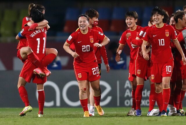 Soccer Football - Women's Asian Cup 2022 - Semi Final - China v Japan - Shivchatrapati Sports Complex, Pune, India - February 3, 2022 China's Shanshan Wang celebrates after the match with teammates REUTERS/Francis Mascarenhas