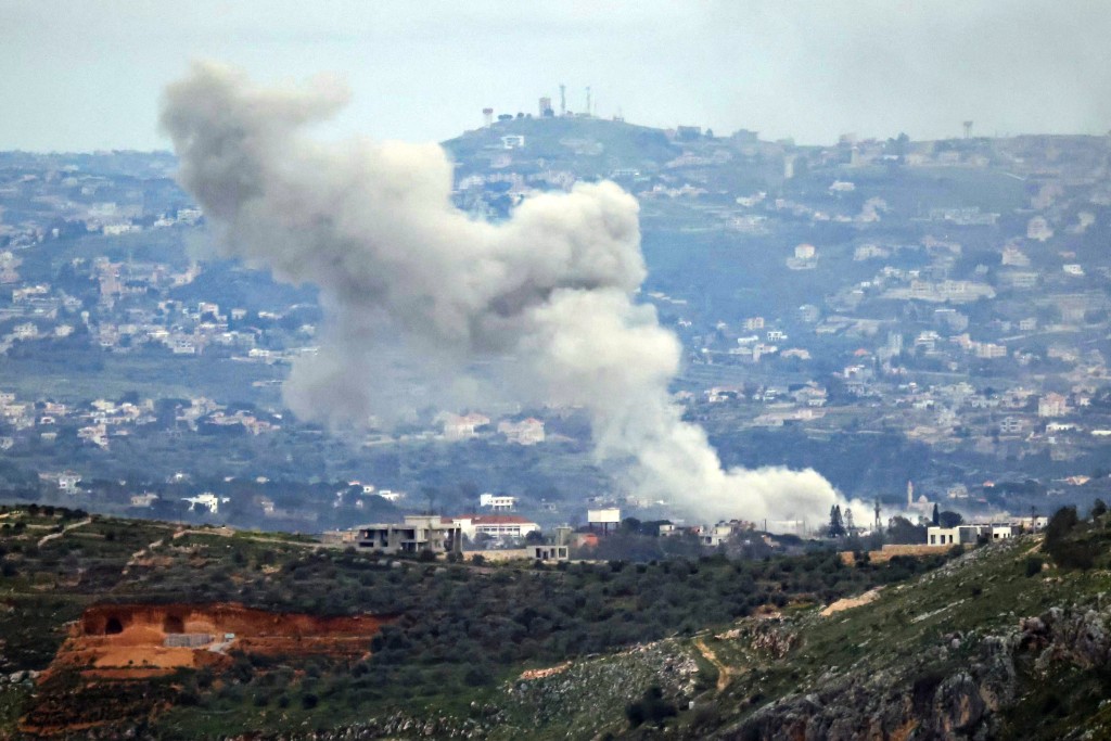Photo by - / AFP Smoke rises from the site of an Israeli air strike that targeted the southern Lebanese village of Dayr Seryan on March 25, 2026.
