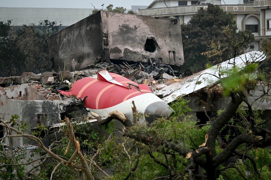 Photo by PUNIT PARANJPE / AFP  Debris of Air India flight 171 is pictured after it crashed in a residential area near the airport in Ahmedabad on June 13, 2025.