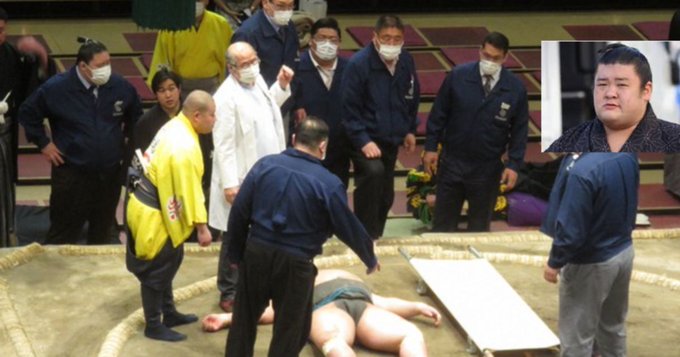 Medical staff gather to examine sumo wrestler Hibikiryu, who collapsed in the ring at Tokyo's Ryogoku Kokugikan, on March 26, 2021. Medical staff gather to examine sumo wrestler Hibikiryu, who collapsed in the ring at Tokyo's Ryogoku Kokugikan, on March 26, 2021.