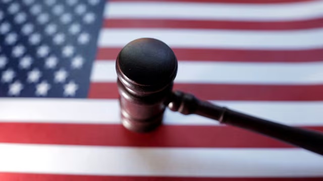 U.S. flag and judge's gavel are seen in this illustration created on August 6, 2024. REUTERS/Dado Ruvic/Illustration