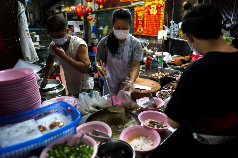 Adulwitch Tangsupmanee, 42, and Jirintat, son and daughter of Chanchai Tangsupmanee, who died at age 73 of the coronavirus disease (COVID-19) in July, during Thailand's worst wave of infections prepare meals at their late father's food stall in Bangkok's Chinatown, Thailand, October 6, 2021. Adulwitch Tangsupmanee, 42, and Jirintat, son and daughter of Chanchai Tangsupmanee, who died at age 73 of the coronavirus disease (COVID-19) in July, during Thailand's worst wave of infections prepare meals at their late father's food stall in Bangkok's Chinatown, Thailand, October 6, 2021.