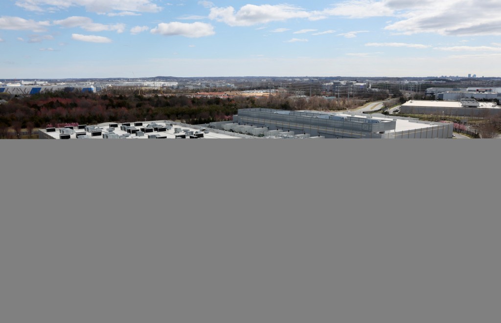 A car drives past a building of the Digital Reality Data Center in Ashburn, Virginia, U.S., March 17, 2025. REUTERS/Leah Millis