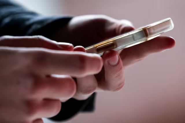 A 16 year old uses his phone, in Madrid, Spain February 3, 2026. REUTERS/Violeta Santos Moura