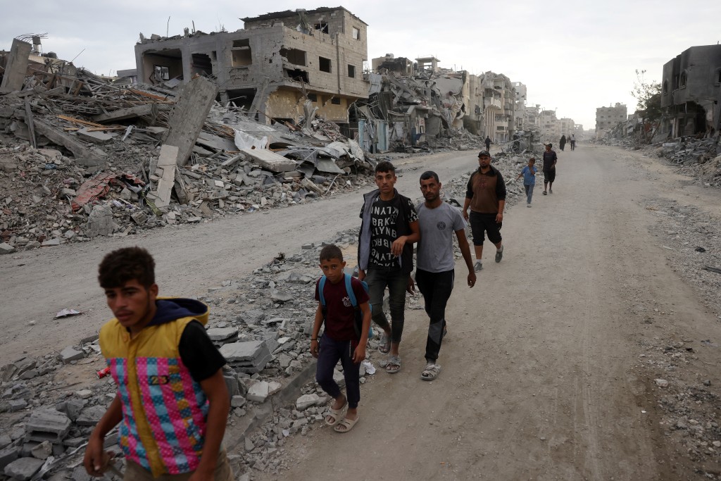 Hundreds of thousands of Palestinians returned to a devastated Gaza City, after an Israel-Hamas ceasefire came into effect, and as both sides discuss implementing US President Donald Trump's 20-point plan to end the war, which calls for Hamas' disarmament and for the group not to be involved in running post-war Gaza. (AFP)