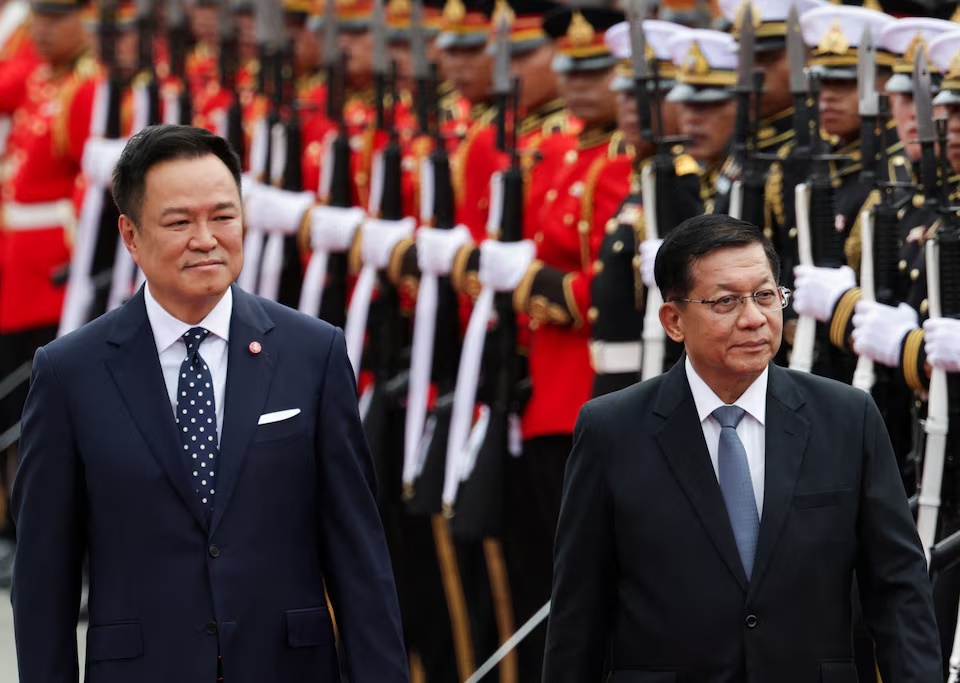 Thailand's Prime Minister Anutin Charnvirakul and Myanmar's President Min Aung Hlaing review a guard of honour during a welcoming ceremony at the Government House in Bangkok, Thailand, August 6, 2026. REUTERS/Athit Perawongmetha