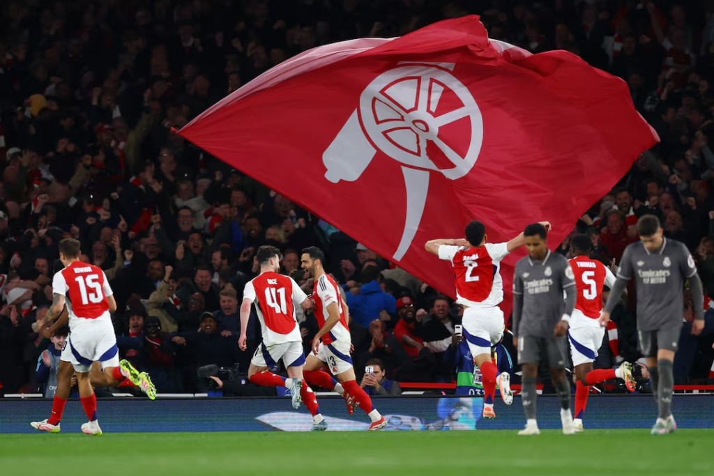 Arsenal's Mikel Merino celebrates scoring their third goal with teammates. (Reuters)