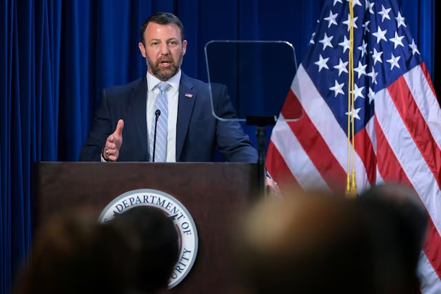 U.S. Secretary of Homeland Security Markwayne Mullin delivers remarks at an event honoring fallen police officers and federal agents at ICE Headquarters in Washington, D.C., U.S., May 13, 2026. REUTERS/Jonathan Ernst