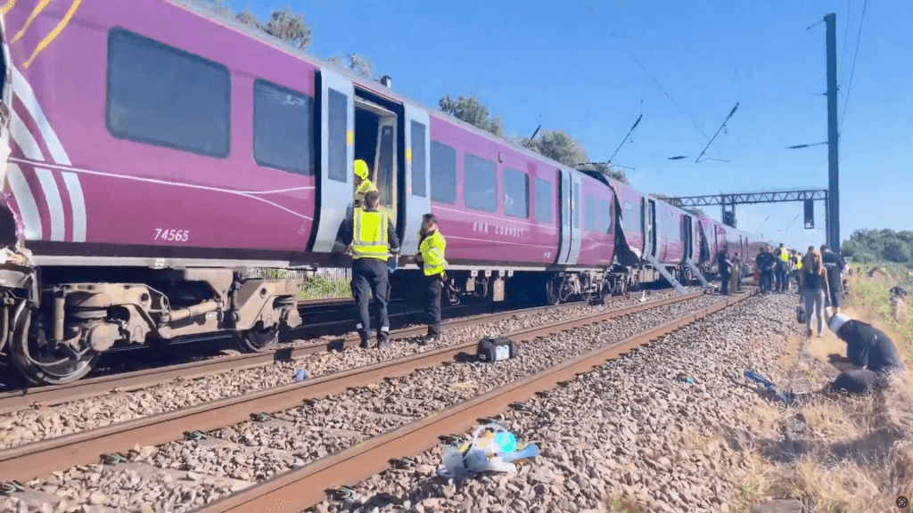 Emergency service workers gather at the scene of a collision involving two trains near Bedford, Britain, June 19, 2026, in this screengrab obtained from a video. Dr Pete Knapp/via REUTERS