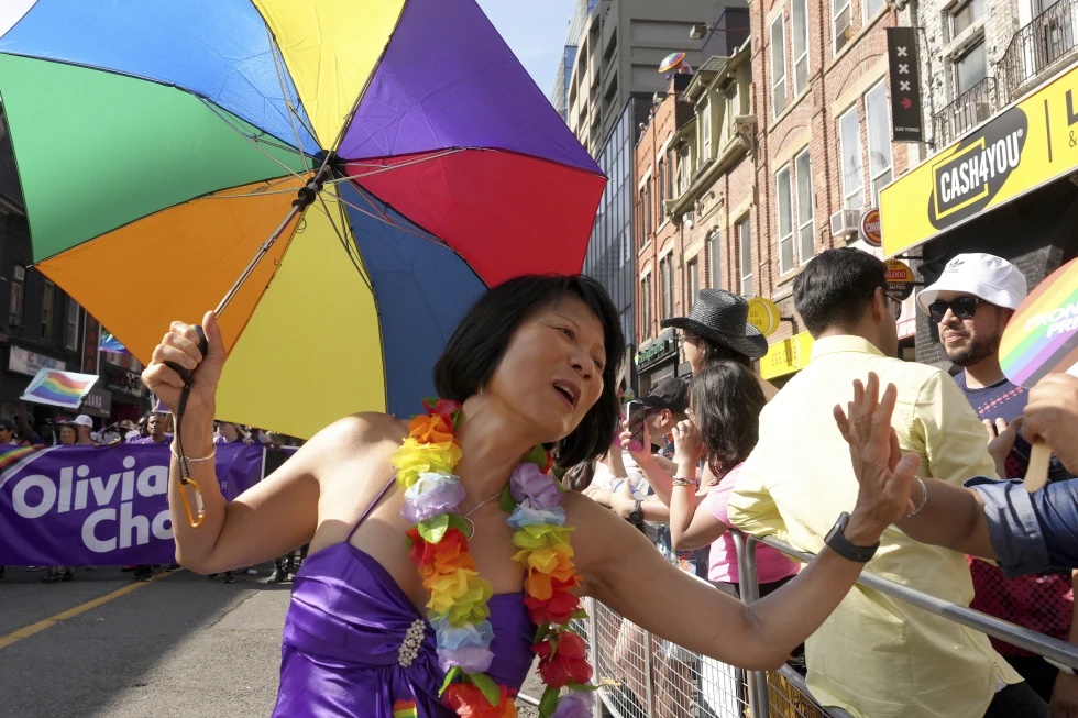 Toronto mayoral candidate Olivia Chow high-fives a spectator as she walks in the Toronto Pride Parade, Sunday June 25. (AP) Toronto mayoral candidate Olivia Chow high-fives a spectator as she walks in the Toronto Pride Parade, Sunday June 25. (AP)