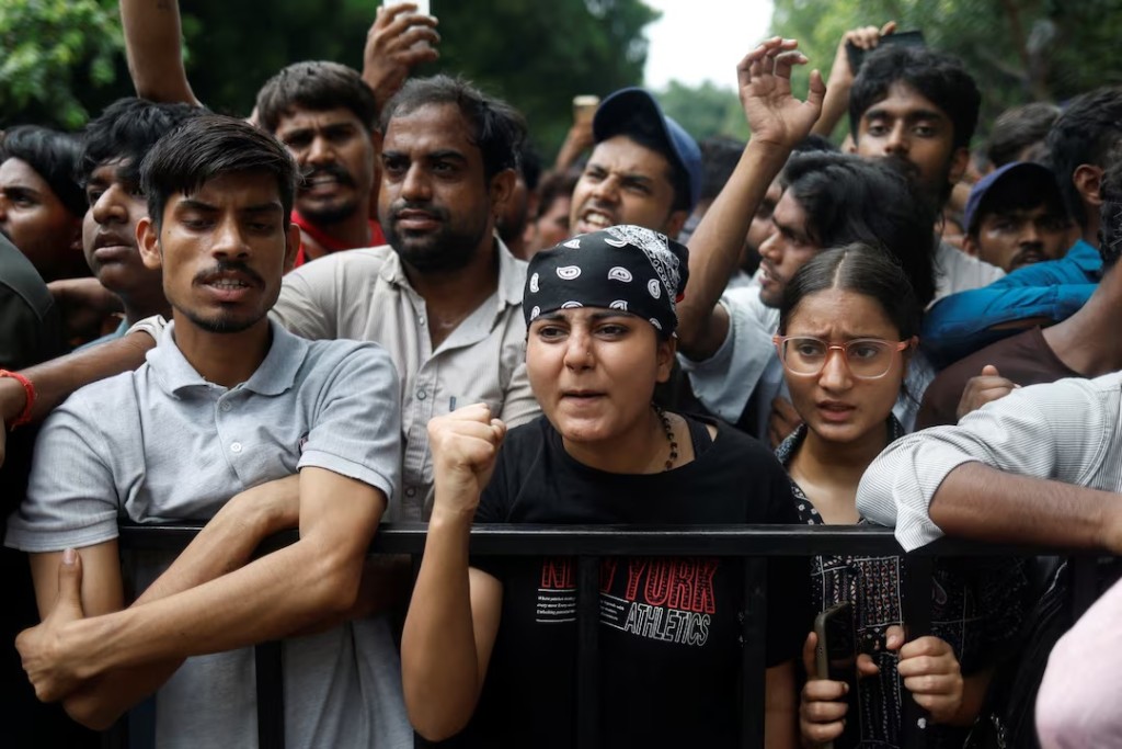 Supporters of India's Cockroach Janta Party (CJP) react at a protest site, a day after thousands of protesters marched toward parliament demanding the resignation of Education Minister Dharmendra Pradhan over examination paper leaks, at Jantar Mantar in New Delhi, India, July 21, 2026. REUTERS/Adnan Abidi