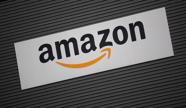 Amazon logo outside an Amazon warehouse in Manchester, Britain, October 28, 2025. REUTERS/Phil Noble