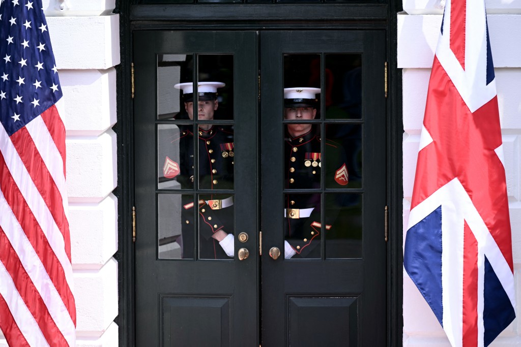 Photo by BRENDAN SMIALOWSKI / AFP  Guards look on during a farewell ceremony for Britain's King and Queen on the South Lawn of the White House in Washington, DC, on April 30, 2026.