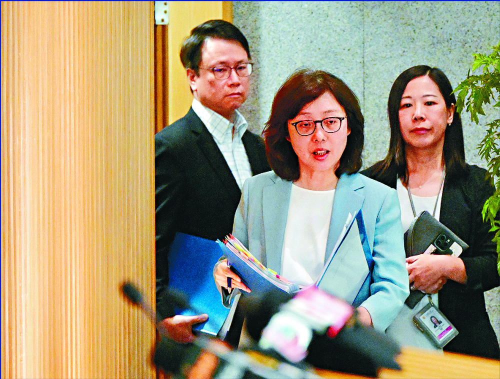 Bernadette Linn, center, says she is cautiously optimistic about the sale.
SING TAO Bernadette Linn, center, says she is cautiously optimistic about the sale.
SING TAO