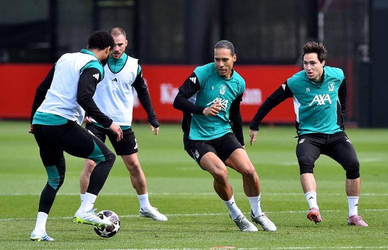 Virgil van Dijk, second right, and Federico Chiesa train with Liverpool on the eve of the clash with PSG.  AFP  