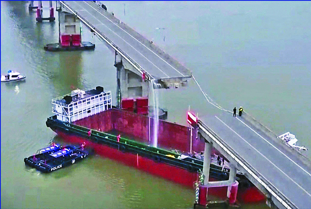 The barge hit two columns of the Lixinsha Bridge in the Pearl River Delta, with several vehicles dropping into the water or onto the vessel. AP, XINHUA The barge hit two columns of the Lixinsha Bridge in the Pearl River Delta, with several vehicles dropping into the water or onto the vessel. AP, XINHUA