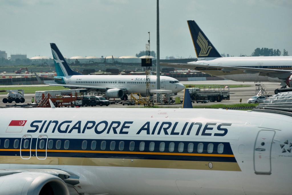Singapore Airlines planes sit on the tarmac at Changi Airport in Singapore November 16, 2021. REUTERS