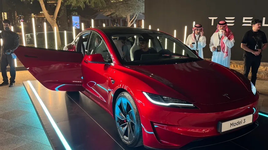 People attend a celebration for the start of Tesla operations in Saudi Arabia in historic Diriyah near Riyadh, Saudi Arabia, on Thursday, April 10, 2025 (AP Photo/Baraa Anwer)