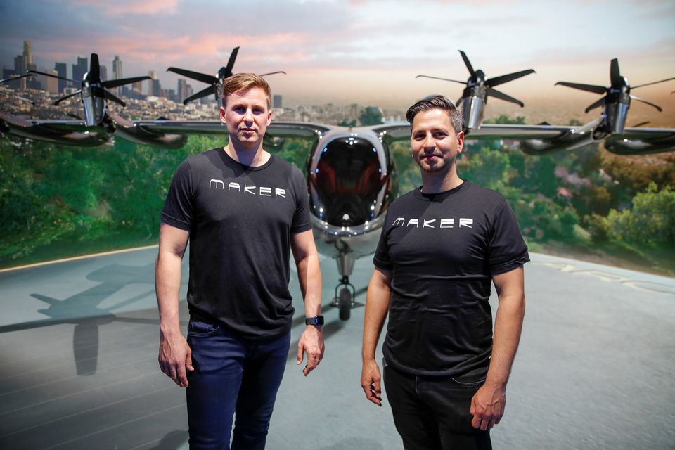 Adam Goldstein, right, and Brett Adcock, co-founders and co-CEOs of flying taxi company Archer Aviation, pose for a picture as they rehearse for the unveiling of their all-electric aircraft from a facility in Hawthorne, California, U.S. June 8, 2021. Adam Goldstein, right, and Brett Adcock, co-founders and co-CEOs of flying taxi company Archer Aviation, pose for a picture as they rehearse for the unveiling of their all-electric aircraft from a facility in Hawthorne, California, U.S. June 8, 2021.