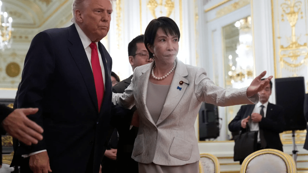 President Donald Trump, left, is escorted by Japan’s Prime Minister Sanae Takaichi during a meeting with families of Japanese abductees by North Korea at Akasaka Palace in Tokyo, Japan, Tuesday, Oct. 28, 2025. (AP Photo/Mark Schiefelbein)