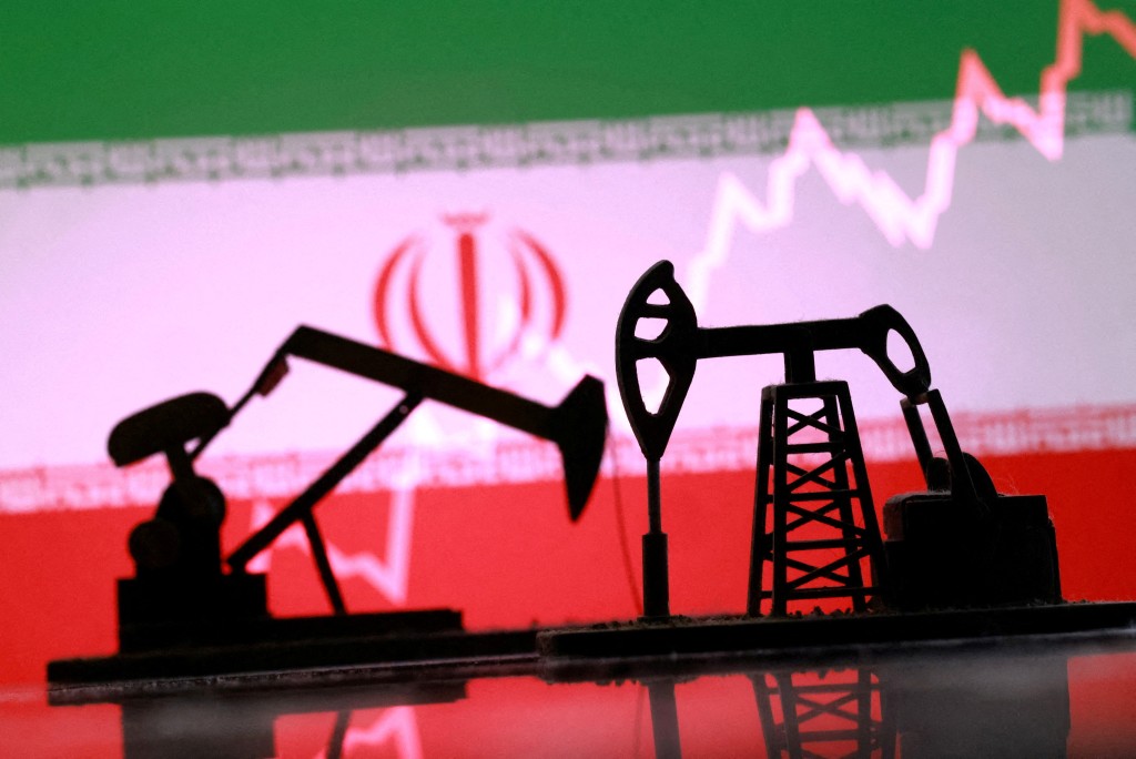 3D-printed oil pump jacks, Iranian flag, and a rising stock graph appear in this illustration taken March 2, 2026. REUTERS/Dado Ruvic/Illustration